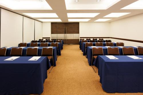 an empty room with chairs and a board in it at Holiday Inn Mexico City-Plaza Universidad by IHG in Mexico City