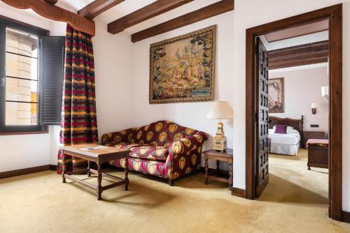 a living room with a couch and a table at Eurostars Los Agustinos in Haro