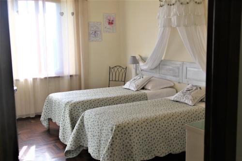 A bed or beds in a room at CASA VACANZE CLAUDIA- 10 min da Siena