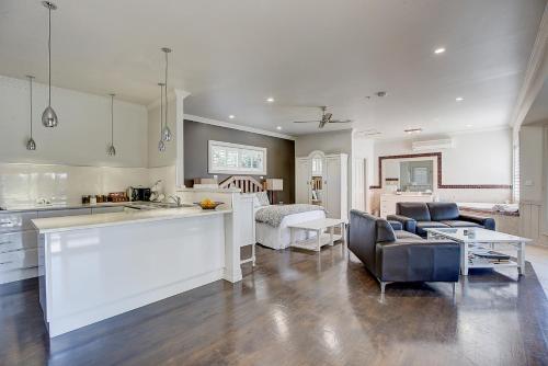 a kitchen and living room with a couch and a table at Evanslea Luxury Boutique Accommodation in Mudgee