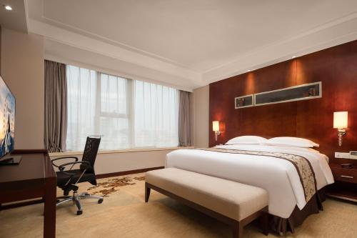 Cama o camas de una habitación en Leisure Hotel