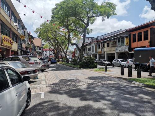 a city street with cars parked on the side of the road at Meritin Hotel in Kuching