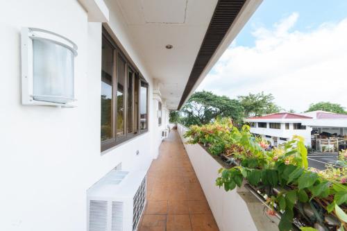 an empty balcony of a building with plants at RedDoorz @ Arimbay Legazpi City in Legazpi