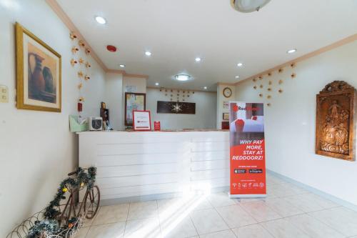a restaurant with a counter in a room at RedDoorz @ Arimbay Legazpi City in Legazpi
