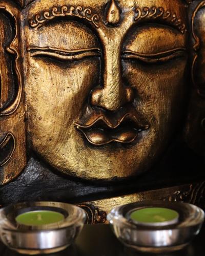 a close up of a gold mask with three bowls at Star View Boutique Resort in Dumaguete