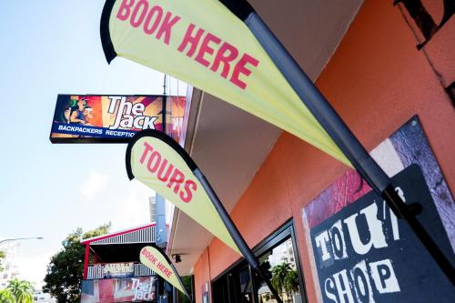 a sign that reads cook here on a restaurant at The Jack Backpackers in Cairns