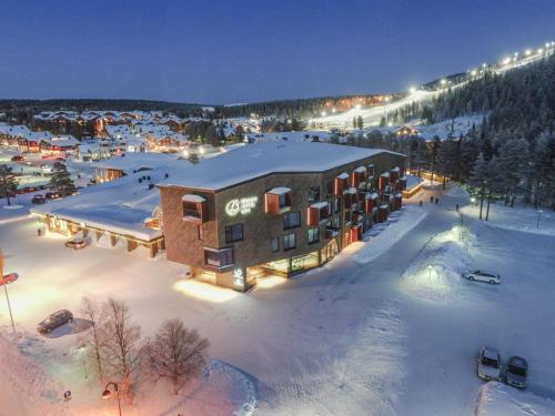 an aerial view of a resort in the snow at night at Design Hotel Levi in Levi