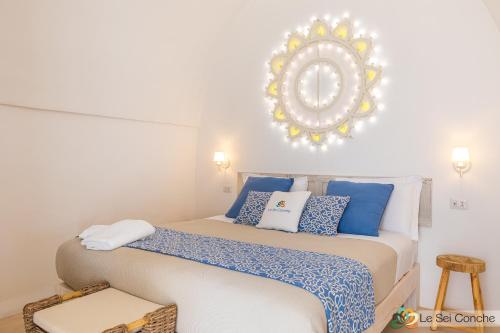 Postel nebo postele na pokoji v ubytování Le Sei Conche Relais & SPA