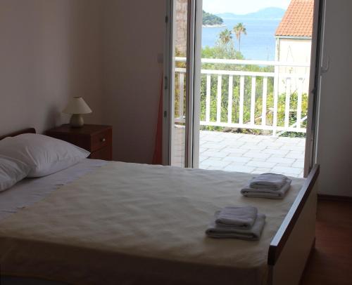 Postel nebo postele na pokoji v ubytování Apartments T & D
