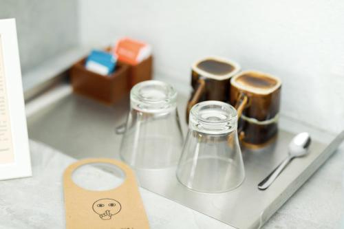 a tray with two glass jars and a price tag at Eva Lanka Hotel - Beach & Wellness in Tangalle