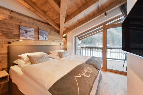 Säng eller sängar i ett rum på Venediger Lodge