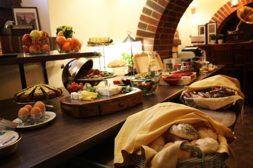 a buffet line with many different types of food at Polonia Raciborz in Racibórz