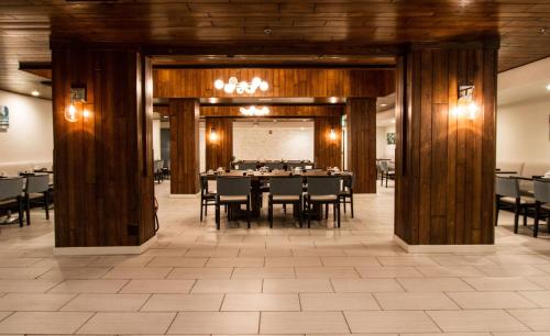 a dining room with a table and chairs at Holiday Inn Victorville by IHG in Victorville
