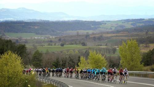 a group of people riding bikes down a road at Hotel Solana del Ter in Ripoll