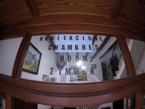 a reflection of a sign in a glass door at Casa Margarita in Sóller