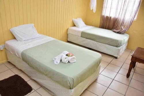 Tempat tidur dalam kamar di Aanola Villas A5 Hushed Hacienda