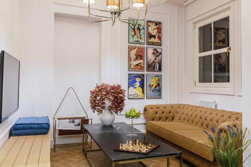 a living room with a couch and a table at The Soul Istanbul Hotel in Istanbul