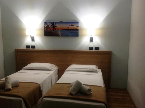 Ένα ή περισσότερα κρεβάτια σε δωμάτιο στο Hotel Paradiso