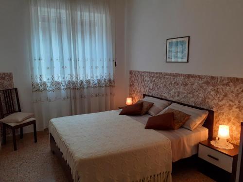 Posteľ alebo postele v izbe v ubytovaní Saglia Apartments