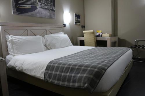 Cama o camas de una habitación en Hotel Garibaldi