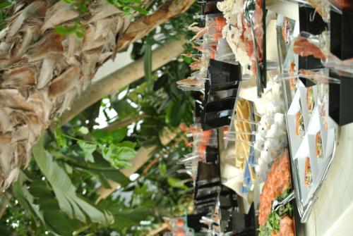 a bunch of food hanging from the ceiling of a store at Crowne Plaza Verona Fiera by IHG in Verona