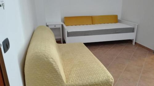 Ein Bett oder Betten in einem Zimmer der Unterkunft Casavacanze corallo