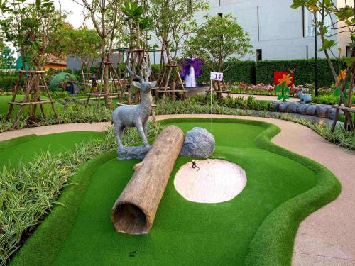 a statue of a deer on a miniature golf course at SO/ Sofitel Hua Hin in Cha Am