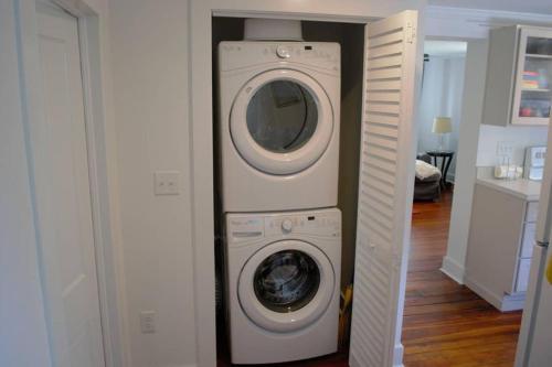 a washer and dryer in a small room at Renovated Historic Loft in the Heart of Downtown in Beaufort