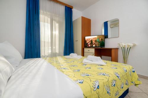 Postel nebo postele na pokoji v ubytování Apartments Matej