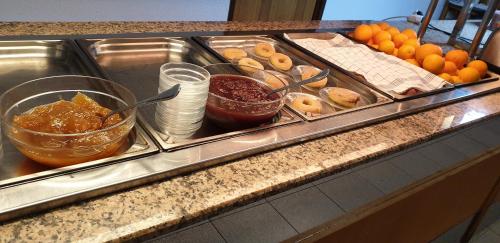 a buffet with a bunch of food on a counter at Soller Garden in Port de Soller