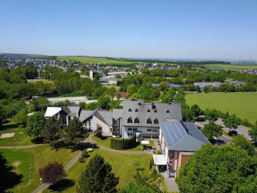 an aerial view of a house with solar panels on its roof at BurgStadt-Hotel in Kastellaun