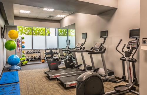 a gym with treadmills and elliptical machines at Holiday Inn Arlington at Ballston, an IHG Hotel in Arlington