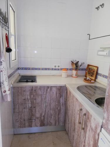 a small kitchen with a sink and a counter at Apartamento Green Golf Islantilla in Islantilla