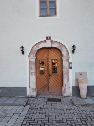 a wooden door in the side of a building at Flösserhaus - Kirchbichl Top 1 in Kirchbichl