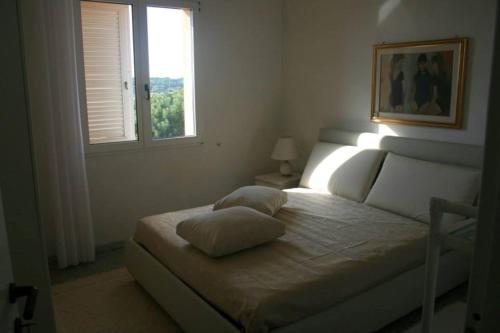 Tempat tidur dalam kamar di B&B Domus Oriens - monolocale indipendente in villa