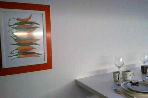 a white table with a picture of a christmas tree at Charming Family Lodge With Private Garage in Florence