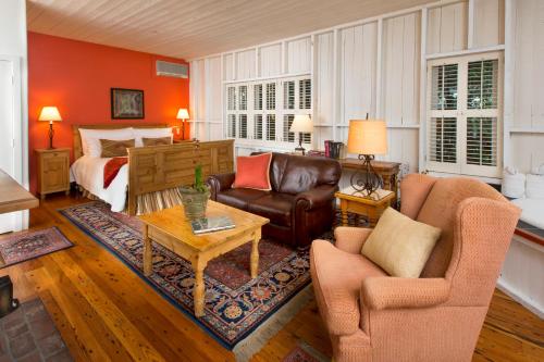 a living room filled with furniture and a fireplace at Simpson House Inn in Santa Barbara