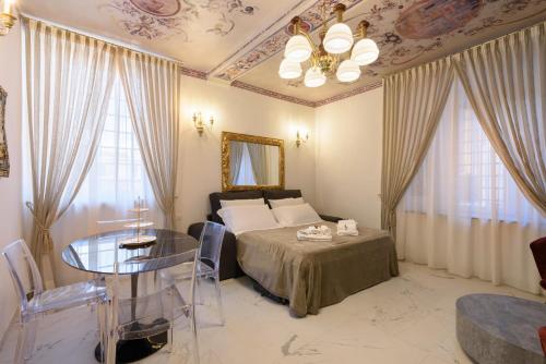 Krevet ili kreveti u jedinici u okviru objekta Domus Nannini SPA - L' Arco di Matteotti