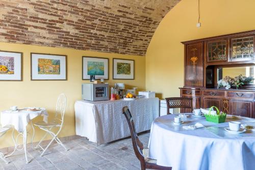 a dining room with a table and chairs at Torre della Loggia - Dimora Storica - Ortona in Ortona