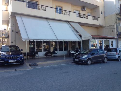 a car is parked in front of a building at Danai's Loft in Heraklio