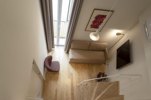 a bathroom with a toilet and a stairway at Lisbon Serviced Apartments - Santos in Lisbon