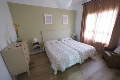 A bed or beds in a room at Apartaments Sa Calm Les roques del rei