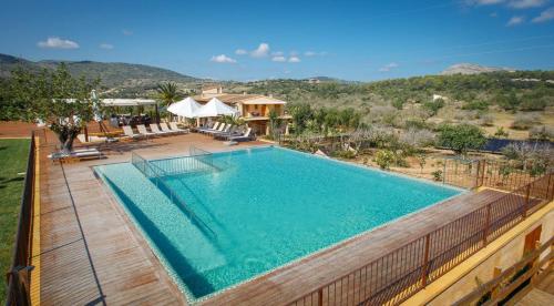 a swimming pool with a fence around it at Agroturismo S'Arboçar in Sant Llorenç des Cardassar