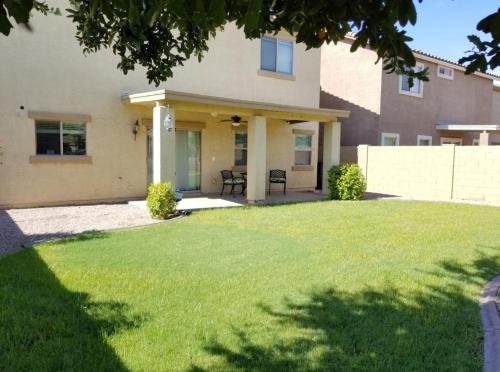 a house with a lawn in front of it at Phoenix I, Minutes to Airport and Downtown in Phoenix