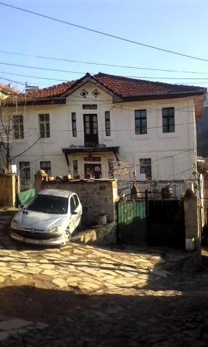 a silver car parked in front of a house at Etno House Shancheva in Kratovo