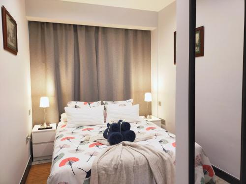 a bedroom with a large bed with an umbrella bedspread at BOHEMIAN & SUITES PANORAMIC -parking in Seville