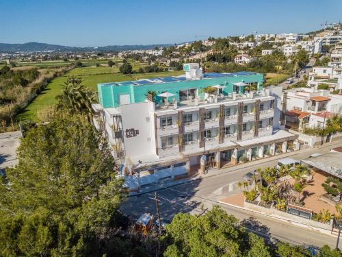 an aerial view of a large white building at Lux Isla in Talamanca