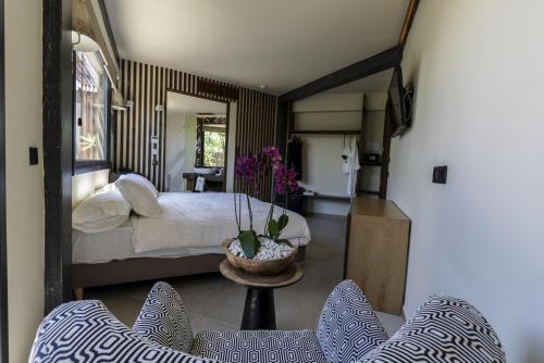 A bed or beds in a room at Hotel Boutique Varadero