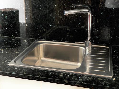 a sink in a kitchen with a faucet at Apartamento San Francisco in Santa Cruz de la Palma