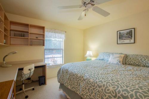 a bedroom with a bed and a desk and a desk at Park Shore Resort, 1st Floor, Bldg. B in Naples